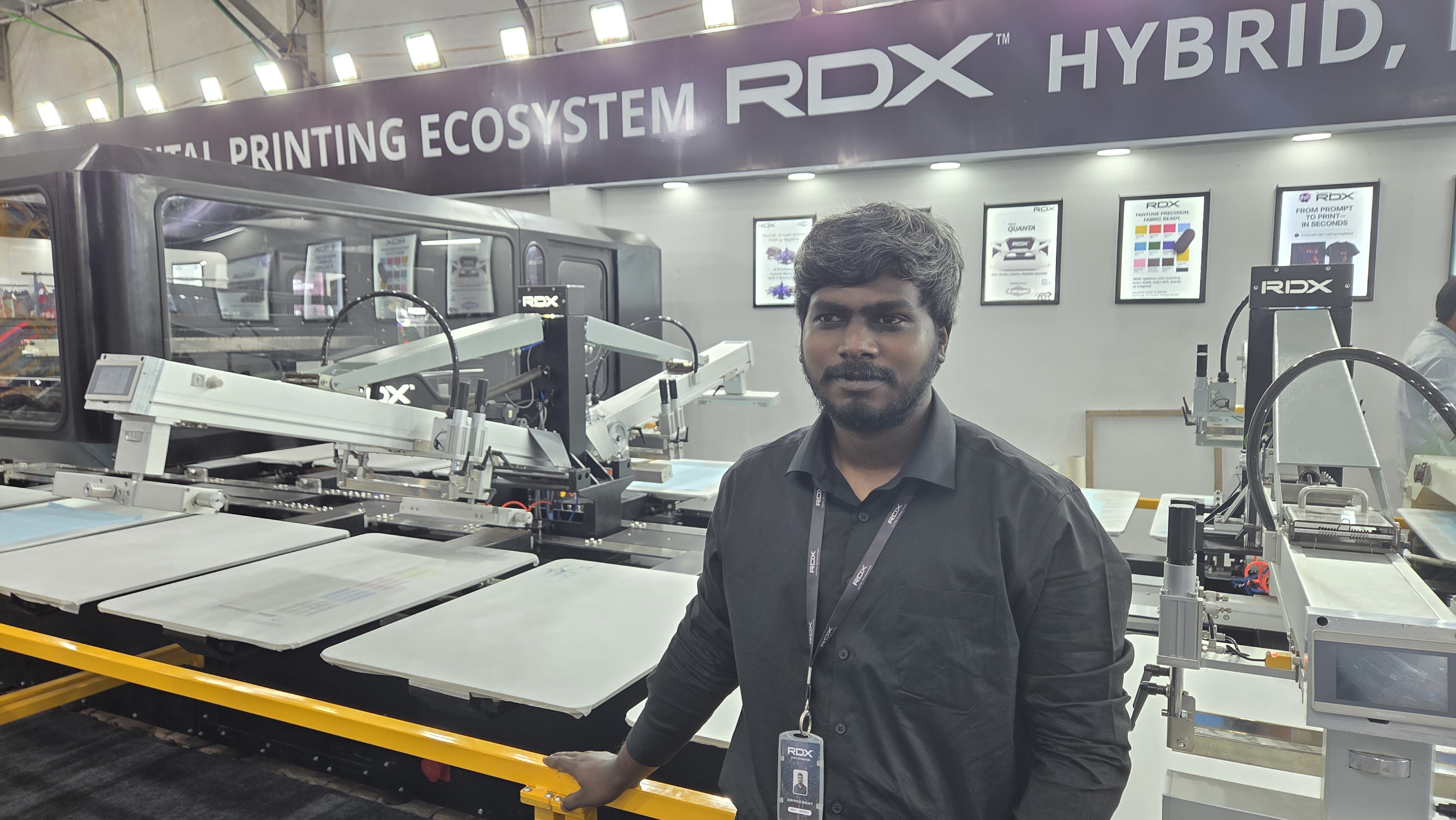 Lead engineer at RDX booth with ORBITON machine demonstration